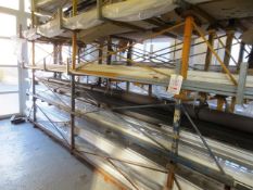 Four steel profile stillages, approx 4m in length (Please note: this lot must be collected on