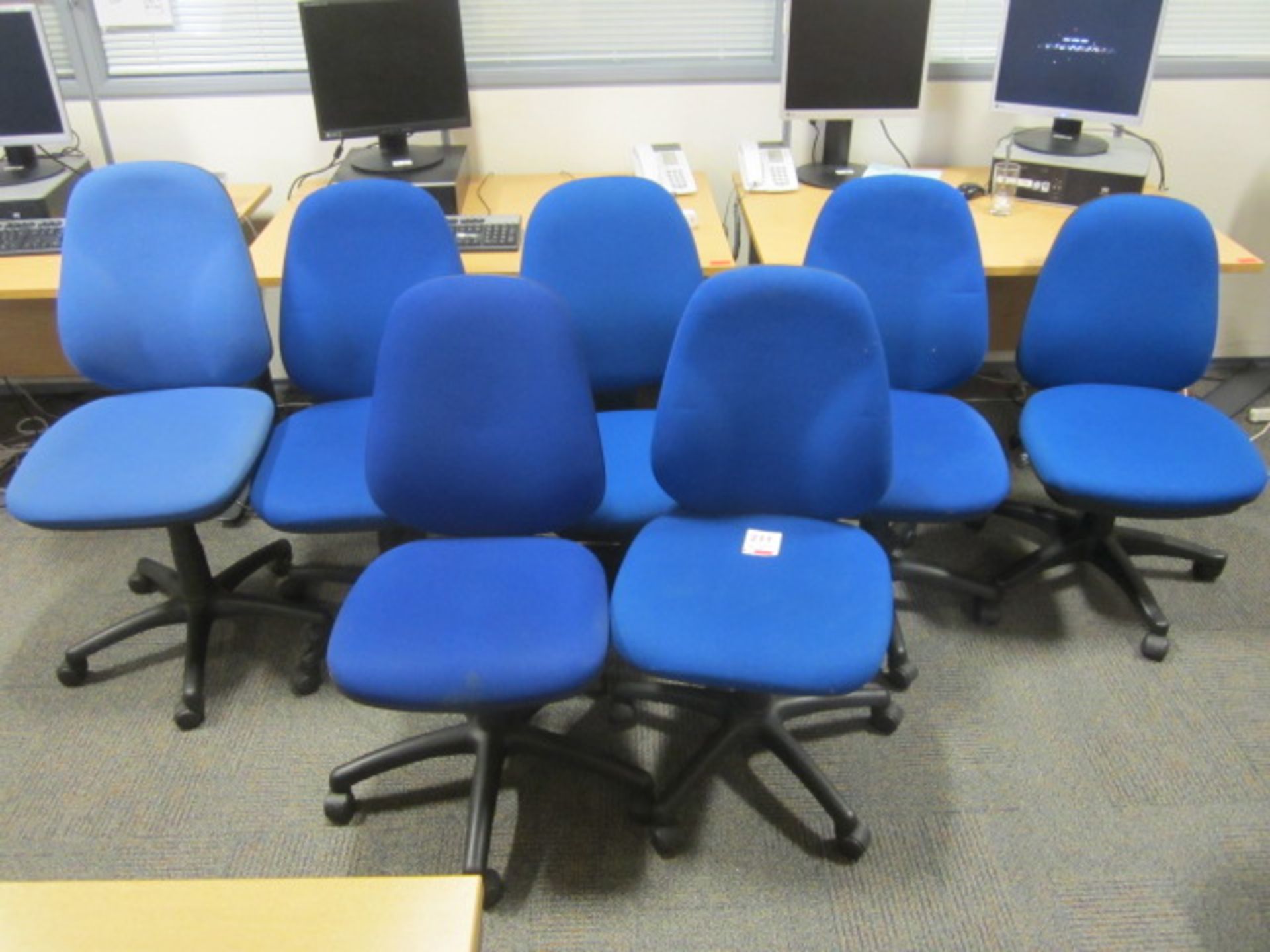 7 x Blue upholstered swivel chairs