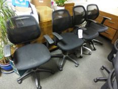 Four black mesh/cloth swivel arm chairs