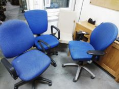 Three office swivel arm chairs and an oak framed, cream upholstered dining chair with burn mark