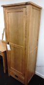 Oak framed, single door wardrobe with lower drawer, hanging rail and top shelf. Approx. 670 x 530