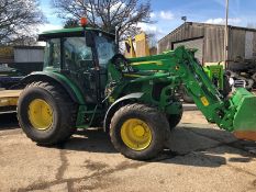 John Deere 5070M four wheel drive tractor on grassland tyres with John Deere 583 loader and