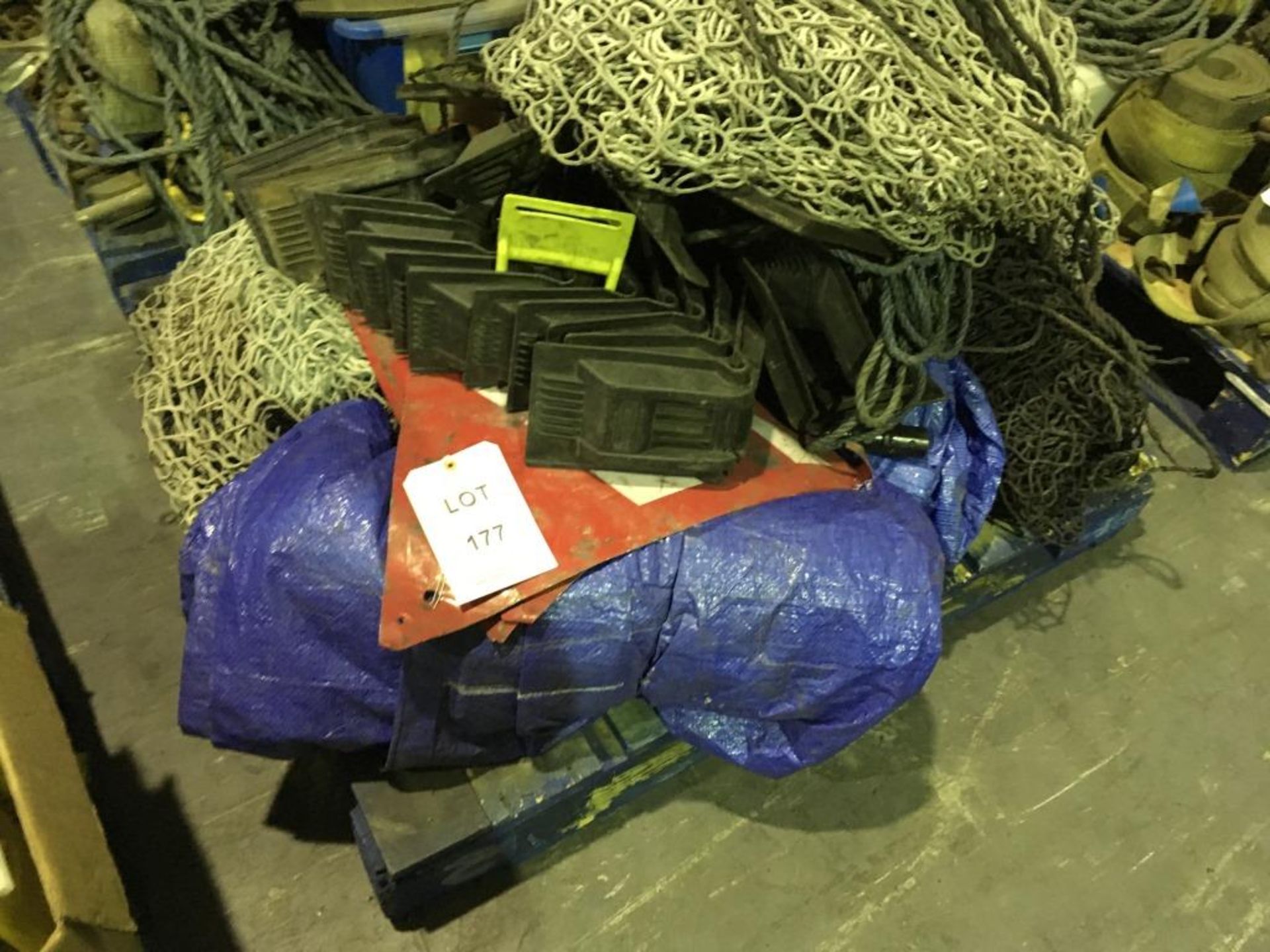 Assorted tarpaulin sheets, cargo nets and corner protectors on one pallet. Please note: This