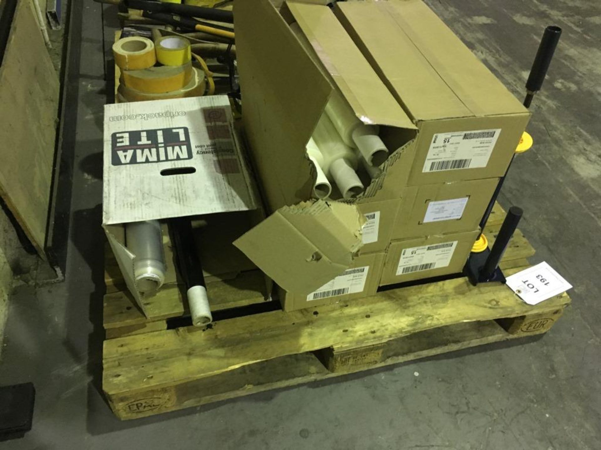 Assorted pallet wrapping with wrap dispenser on one pallet. Please note: This lot is located at 6