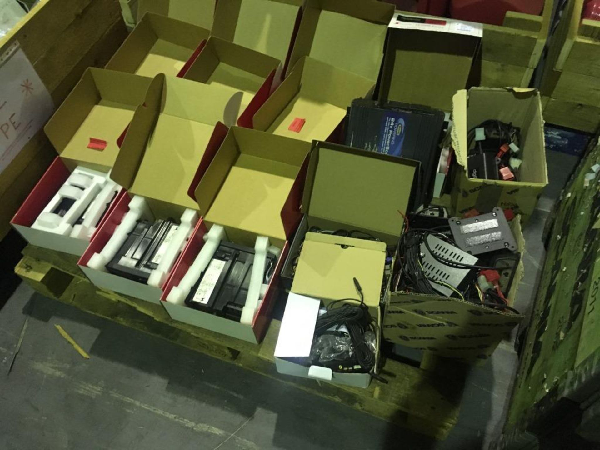 A quantity of cab electronics, radios, chillers and microwaves (some known to be faulty) on three