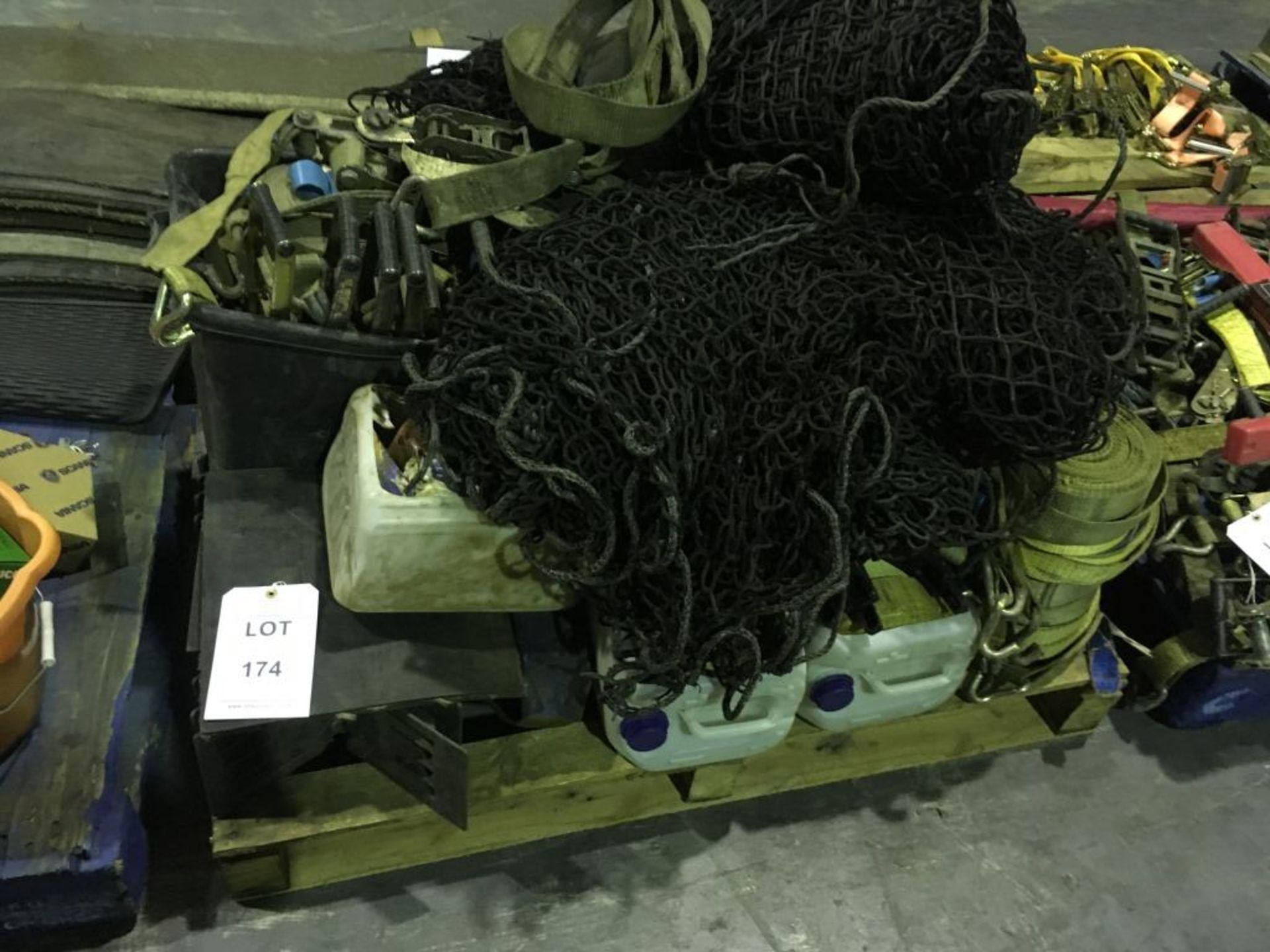 Assorted cargo nets, ratchets and straps on one pallet. Please note: This lot is
