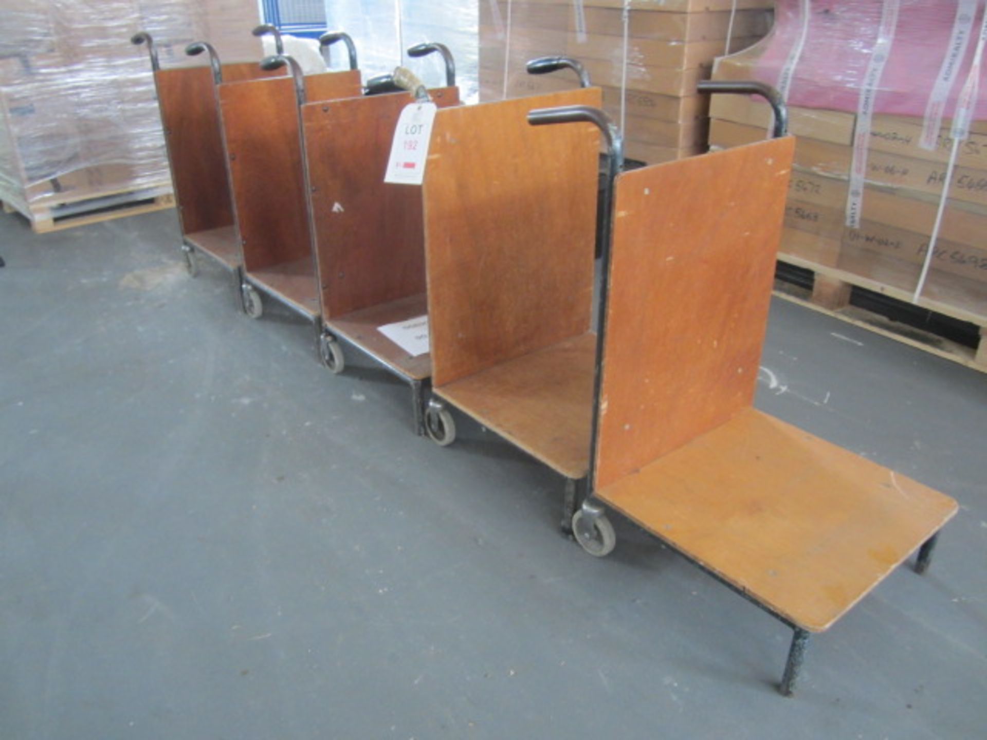 5 x metal frame wood base, back paper movement trollies. - Lift out charge to be applied £5+ vat