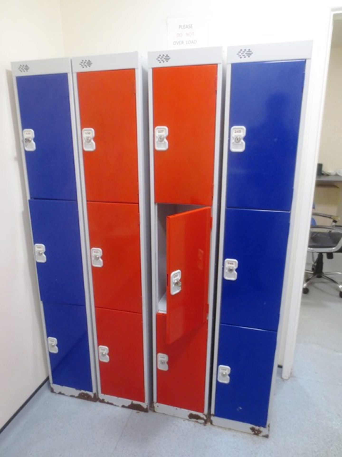 Ten blue/red steel 3 locker lockable units (no keys available) (only four in picture)