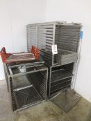 Three stainless steel, 12 tier tray racks, and assorted trays