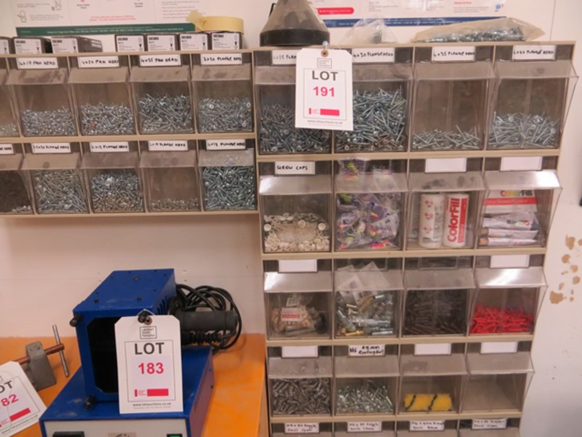 Wall Mounted 34 Position Perspex Fronted Storage Unit c/w Screws & Fixings Etc., as lotted