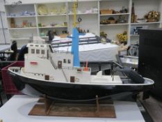 A battery powered Model Boat named 'Erica Rose' c/w controller (est £100-£150)