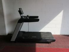 * A Pulse Fitness Model 260G Treadmill with interactive screen, heart rate monitors, cup holders,