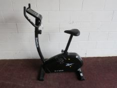 A Reebox ZR7 Upright Exercise Bicycle (needs new batteries)