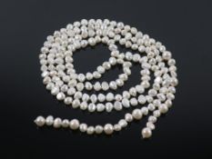 A String of Freshwater Pearls weighing approx 46g and 110cm long (est £100-£150)