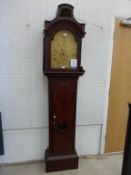 A 19th Century Mahogany Longcase Clock with domed top, shaped door with glass panel, silvered dial