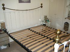 A white framed King Size Bed with Brass Highlights to the Head and Footboards, complete set of Slats