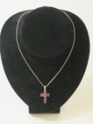 A Silver and Natural Ruby Cross on Silver Chain (est £30-£60)