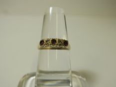 A 9ct Gold Ruby and Diamond Ring (size O) (est £100-£200)