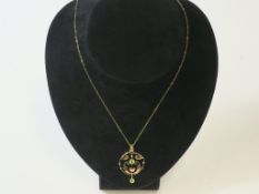 An Antique (c. 1910) 9ct Gold and Peridot Pendant on a 9ct Gold Chain (est £40-£80)