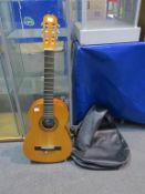 A Spanish made BM Clasico 6 string Guitar (4 strings only) in Faux Leather Soft Case (est £20-£40)
