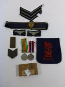 Two World War Two Service Medals, together with a selection of Uniform Badges (est £25-£50)