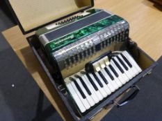 A Sorrento Accordion with Unique Green Colouring in Carry Case (est £70-£100)
