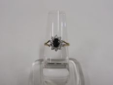 A 9ct Gold Ring with White Stones and Topaz? (Size p) (est £25-£50)