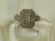 A Multi Diamond Set Cluster Ring in White Metal Shank (size S) (est £100-£200)