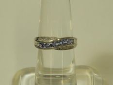 A Diamond and Tanzanite Silver Ring (size O) (est £30-£60)