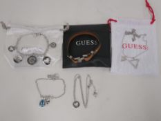 * Five items of new 'Guess' jewellery to include Pendants and Bracelets (all but one with either a