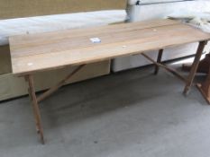 A folding wooden Trestle Table (H76cm, W182cm, D65cm) (est £20-£40)