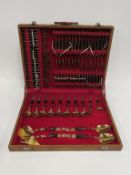 A seventy piece, eight placement canteen of Gold coloured with Black Handles 'Siam' Cutlery in its