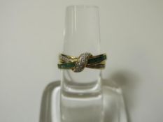 A 9ct Gold Diamond and Emerald (?) (one stone missing) Ring (size O) (est £30-£60)