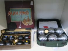 A boxed set of Banda Carpet Bowls and a cased set of Boules (Pentanque) together with an unused,