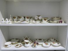 Two Shelves to include a selection of over 50 pieces of Royal Albert Old Country Roses Bone China