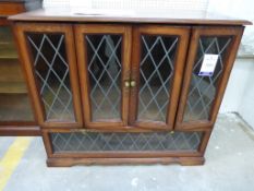 A Large Oak TV/Video Cabinet with folding and hinged leaded-light glazed doors 104cm (£20-£40)