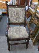 A Large Early 20th Century Oak Carver Chair or Throne (?) with open arms, padded seat and back on