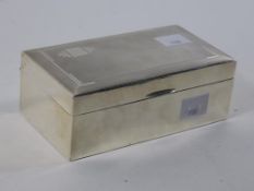 A Hallmarked Silver Birmingham Cigarette Box Lined with partition slots. The box measures H6cm,