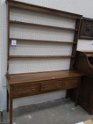 An 18th Century style Oak Welsh Dresser three Open Shelves, over a plain Base with three Frieze