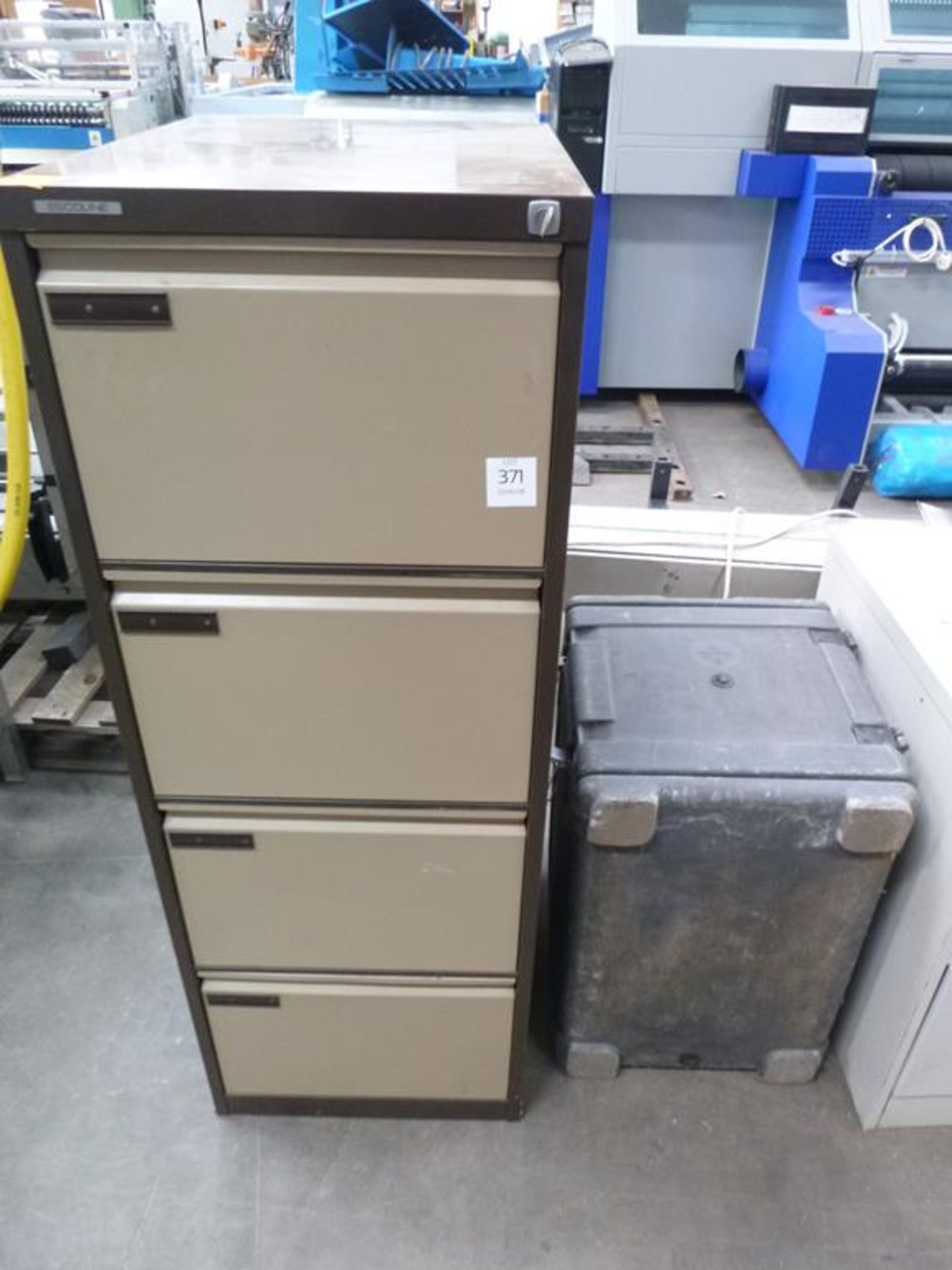 A 4 Drawer Metal Filing Cabinet and a Melform Plastic Flight Case