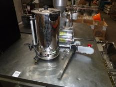 A Stainless Steel Water Boiler and a Commercial Tin Opener