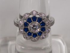 A Blue and White Gem Set White Metal Ring (marked 925) (size O) (est £30-£50)