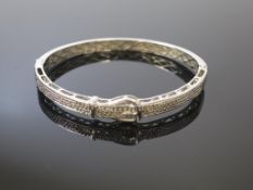 A White Metal Buckle Bracelet Set with Diamonds (est £60-£120)