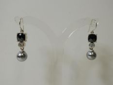 A pair of Silver Dress Earrings (est £20-40)