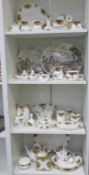 Four shelves to include a selection of over 50 pieces of Royal Albert Old Country Roses Bone China