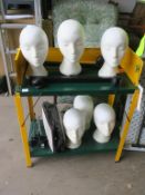 * A yellow & green coloured two tier Table/Bench, together with Six Mannequin Heads and a Dolly