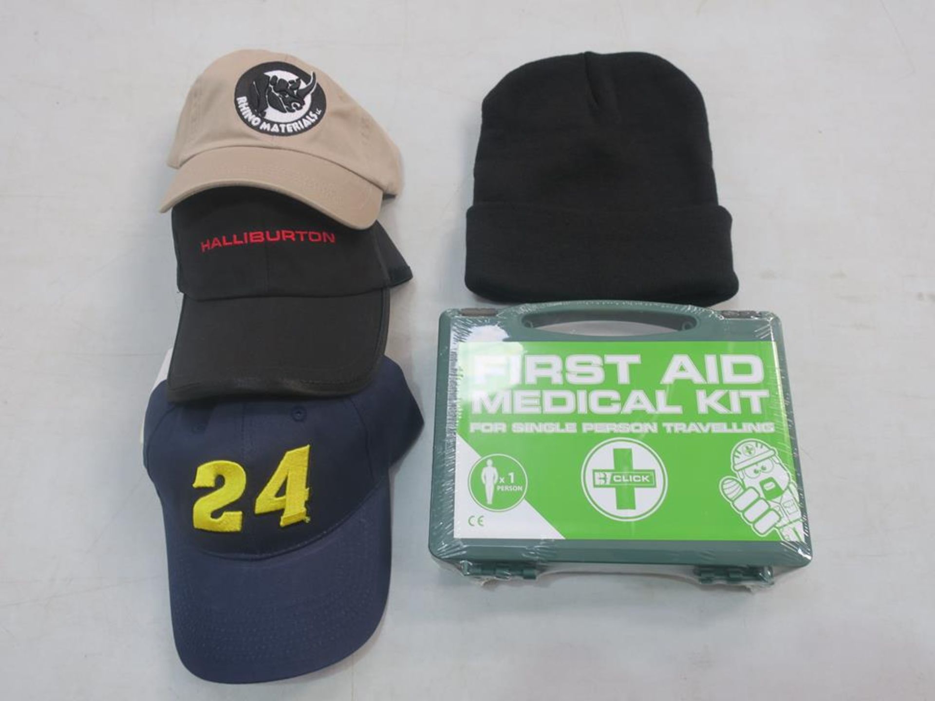 * A box containing assorted items including various Baseball Cups, First Aid Kits and Winter Hats