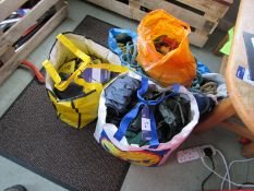 Bag with used waterproofs, Blue Ikea bag containing rope and used gloves, Used gloves (in yellow