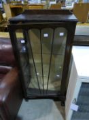 An Edwardian China Cabinet with two glass shelves behind glazed doors (lockable, no key) raised upon
