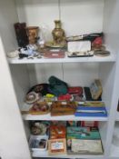 A mixed selection of items on three shelves to include Home Darkroom Developing Items; Darkroom Lamp